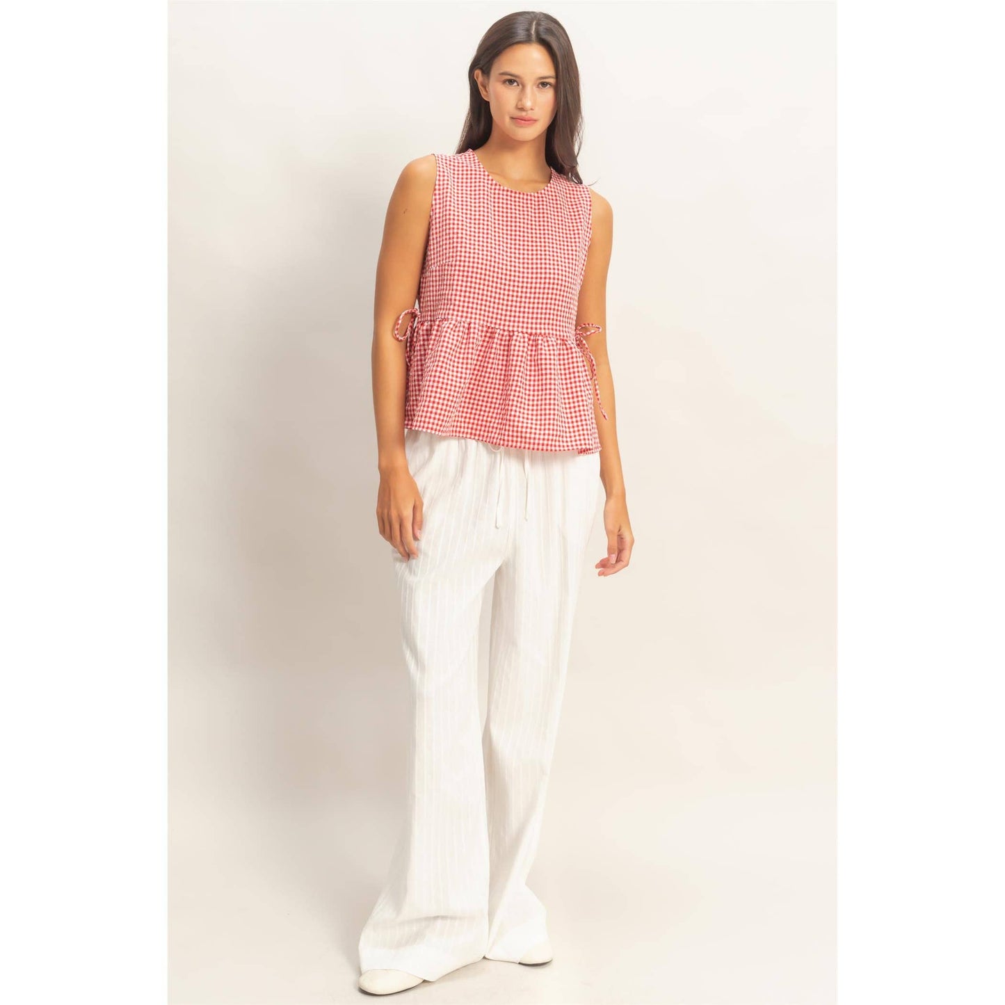 Gingham Sleeveless Peplum Top With Side Ties